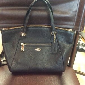 Coach black handbag with gold accents